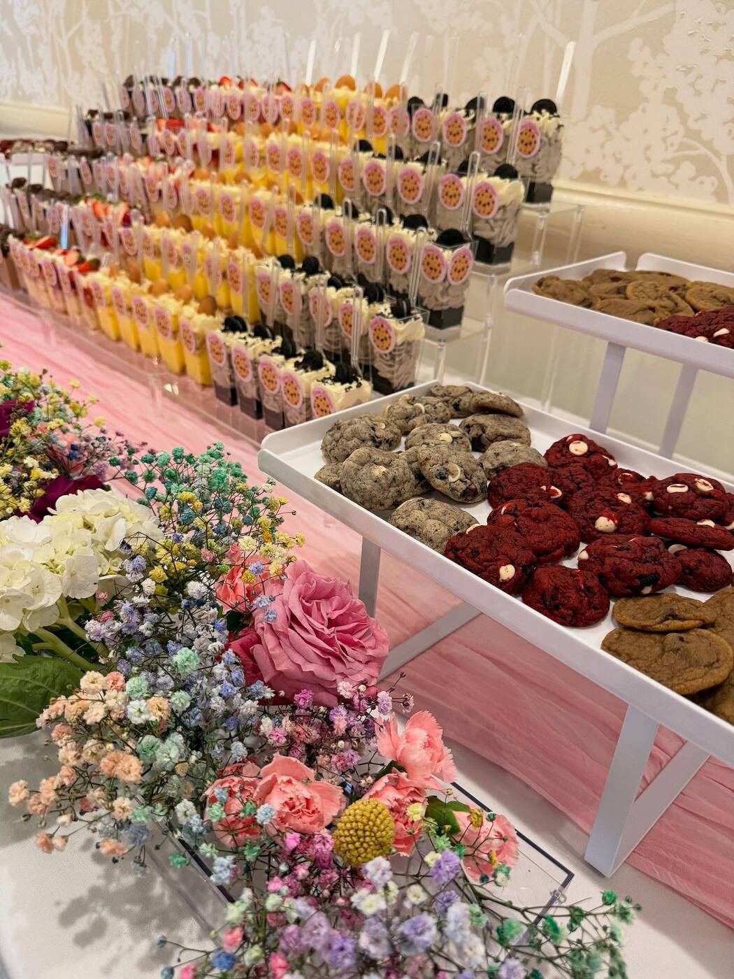 Sweet Siblings dessert table spread with cookies and dessert cups